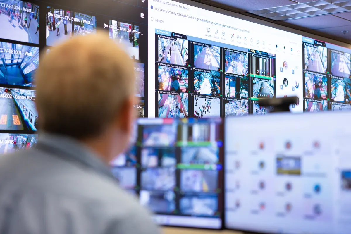 A staff member monitors security cameras in the Emergency Operations Center after a World Cup game